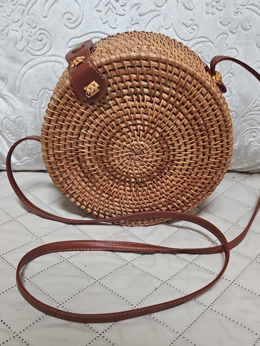 Round Woven Straw Crossbody Bag with Brown Leather Trim